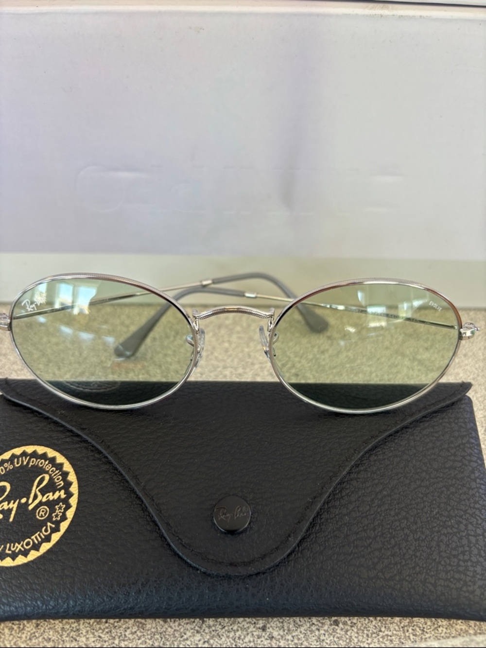 Ray-Ban Silver Oval Sunglasses with Light Tinted Lenses